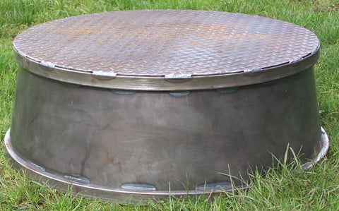 Horse training pedestal built from steel with a diamond plate steel top for traction. Bare metal.