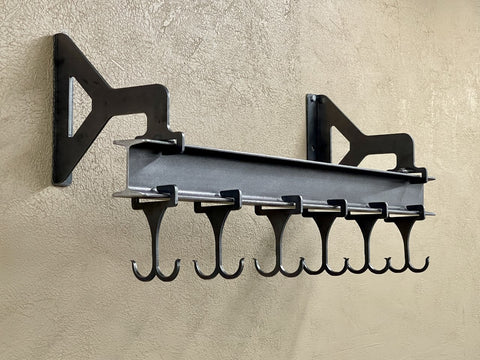 Wall mounted pot rack made from steel I beam with sliding double sided hooks