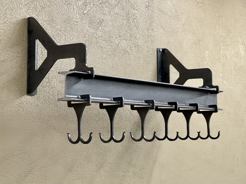 Wall mounted pot rack made from steel I beam with sliding double sided hooks